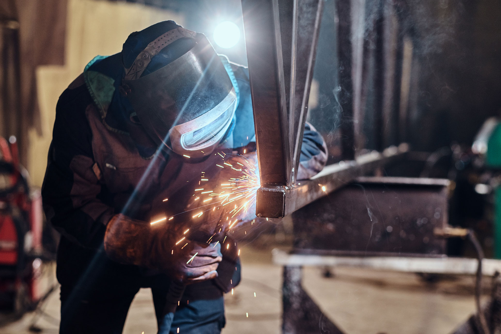 Person welding metal